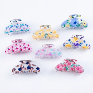 Set of eight assorted floral and fruit pattern hair claw clips in colorful PVC material