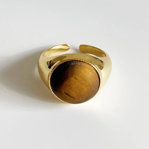 Detailed macro view of a S925 silver ring with a polished tiger eye stone inlay