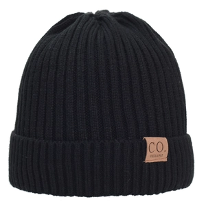 Detailed view of black double-layered knit beanie featuring a brown leather CO. patch