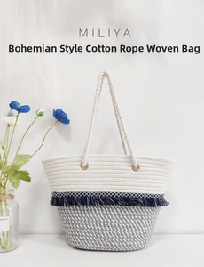 Detail of bohemian cotton rope tote featuring blue tassels and sturdy metal eyelets