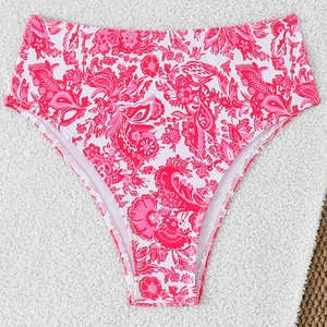 Detail of high-waisted bikini bottoms with red and pink floral patterns on white fabric