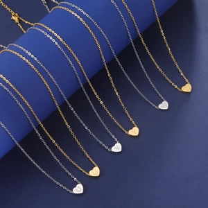 Minimalist heart pendant necklaces with engraved letters in gold and silver steel