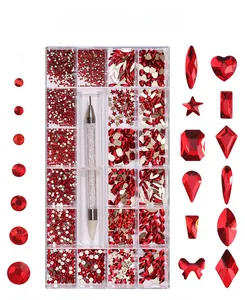 Detailed set of red assorted nail art rhinestones with 21 grids and dual-ended dotting pen
