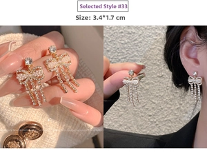 Detail of gold bow tassel earrings with crystals and pearls showing the elegant design