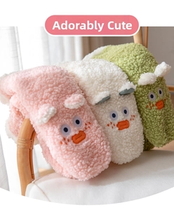 Detailed view of soft coral fleece plush socks in pink, white, and green cartoon designs