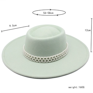 Detail of light green wool boater hat with pearl strap and size measurements