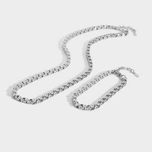 Polished silver stainless steel necklace and bracelet set with unique textured links