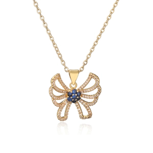 Exquisite gold butterfly pendant necklace with blue zircon flowers on white background