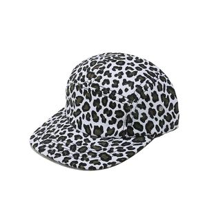 Detail view of leopard print five-panel camper hat with metal eyelets and flat brim