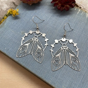 Bohemian vintage cicada moth drop earrings with moon phase design in silver metal