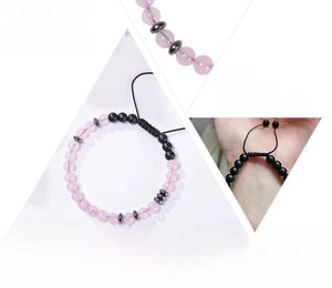 Detailed view of Morse code bracelet featuring pink beads and black metallic accents
