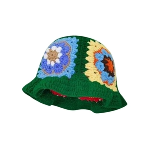 Handmade green crochet bucket hat featuring colorful floral patterns in knitted wool