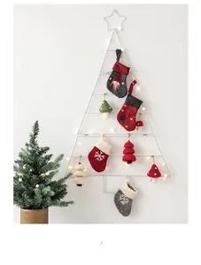 Christmas wall decor with wool felt stockings and ornaments on a metal tree frame with LED