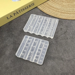 Dual silicone nail art molds showing detailed bow shapes for DIY resin crafts