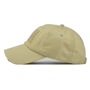 Detailed side view of khaki distressed baseball cap with vintage worn-out cotton fabric