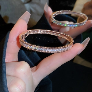 Detailed view of rose gold zircon bracelet with micro-pave setting and side hinge clasp
