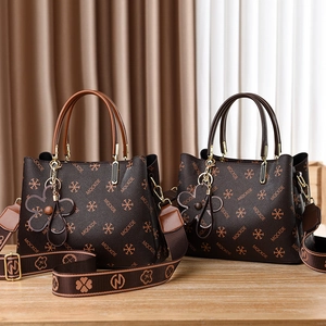 Chic retro print handbags in brown and black with floral charms and wide straps