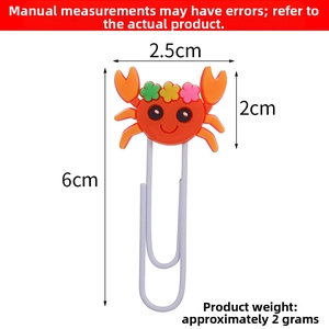 Detail showing an orange crab PVC paperclip with dimensions 6cm height and 2.5cm width