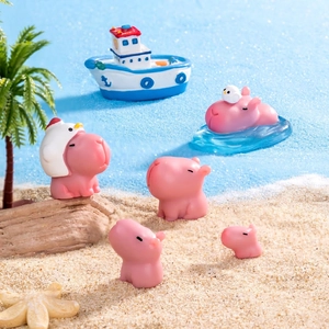 Cute pink Capybara mini figures in a tropical beach micro landscape scene