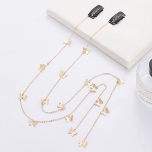 Elegant gold butterfly hair chain with tassel rhinestone clips on a white background