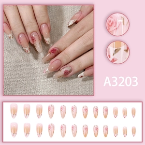 Almond-shaped press-on nails with watercolor rose floral design and pink gradient art
