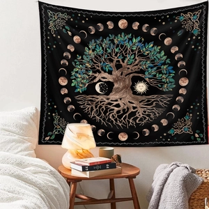 Close-up of tree of life and moon phase wall tapestry in black and gold home decor