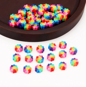 Detailed view of colorful polymer clay flower beads for DIY jewelry making and crafts