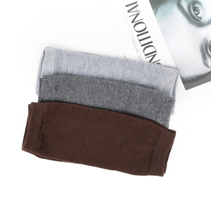 Three pairs of striped knitted arm warmers in grey and brown tones for children