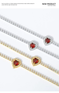 Detail of red heart gemstone necklace in titanium steel with white zircon inlays