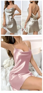 Detail of silk satin slip dress featuring cowl neck and cross back straps in champagne