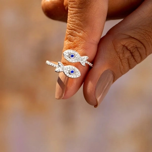 Elegant S925 sterling silver bypass fish ring with cubic zirconia and blue gemstone