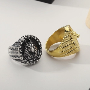 Detailed view of Egyptian themed rings in gold and silver finish with micro-inlaid cubic zirconia
