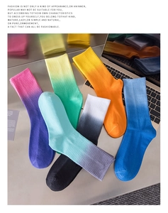 Macro view of six gradient tie-dye crew socks in various colors with ribbed cuffs