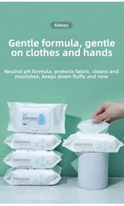 Detail of 80-count down jacket cleaning wipes showing a hand pulling a soft wipe from the pack