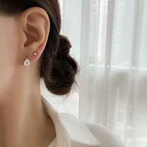 Minimalist 925 sterling silver teardrop earrings worn by model for daily style