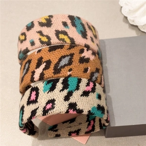 Three plush leopard print headbands for women featuring stylish knitted textured fabrics