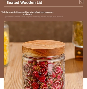 Detail of food-grade glass storage jar showing embossed patterns and airtight bamboo lid