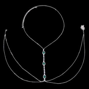 Silver body chain with emerald-cut green crystals and sparkling tassel detail