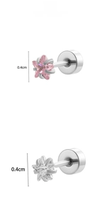 Detailed macro view of 4mm star-shaped screw-back earrings with pink and white cubic zirconia