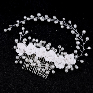 Exquisite bridal hair comb with white ceramic roses, pearls and crystals on silver wire
