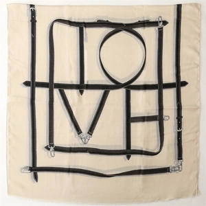 Detailed close-up of beige cotton-linen scarf featuring black belt chain love patterns