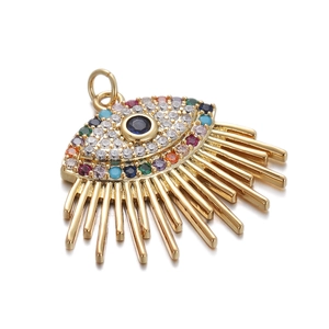 Detailed view of evil eye pendant with colorful zircons and golden metal tassels
