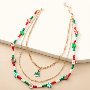 Detail of multi-layer Christmas necklace with beaded charms of Santa and candy