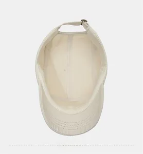 Detail view of cotton baseball cap interior with fine stitching and metal adjustment buckle
