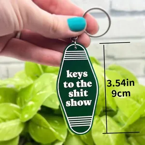 Green acrylic motel keychain with 'keys to the shit show' text for backpack decor