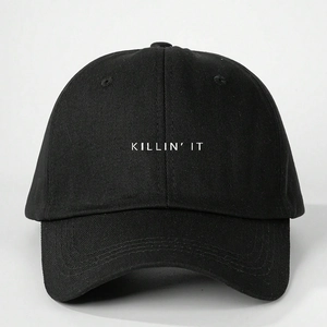 Close-up of white 'KILLIN IT' embroidery on high-quality black cotton baseball cap
