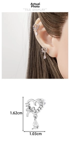Detail of silver heart earring with bow and teardrop zircon showing 1.62cm height