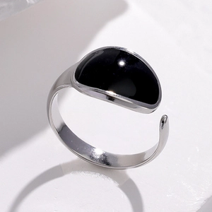 Minimalist adjustable silver stainless steel ring featuring a large black oval gemstone
