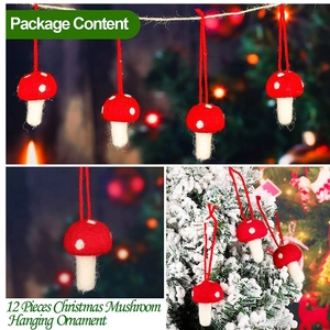 Set of 12 red and white wool felt mushroom ornaments hanging on a festive Christmas tree