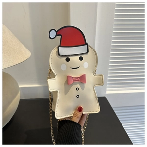 Detail of gingerbread man crossbody bag with red Christmas hat and gold chain strap